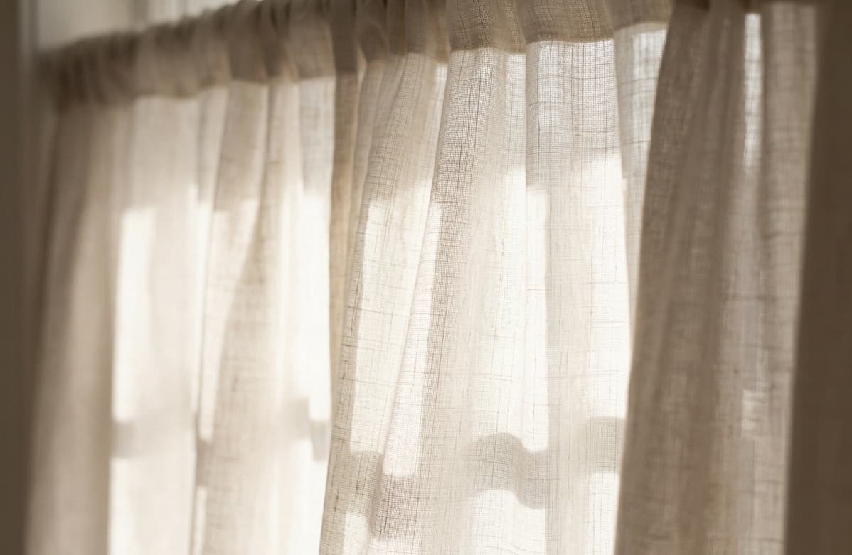 Soft daylight through a sheer linen curtain